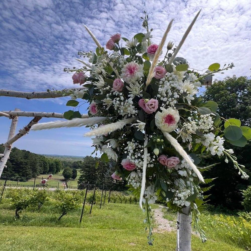 Wildflower Grace cascading bridal bouquet with wildflower charm