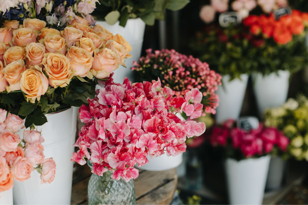 The Wildflower Grace florists arranging fresh flowers in the Friendswood shop